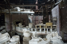 Arkansas Democrat Gazette photo by Cary Jenkins Interior of building that holds one of the tunnel kilns. Piles of plaster molds were throughout the building.Camark Pottery Factory, Camden Arkansas